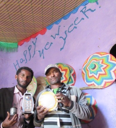 The first solar light switching on inside Shambel's home in Abuserkema